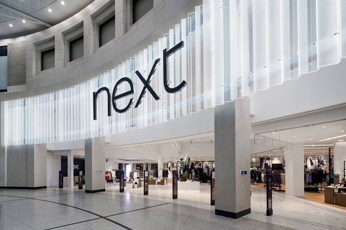 Next beats expectations as it posts record profits