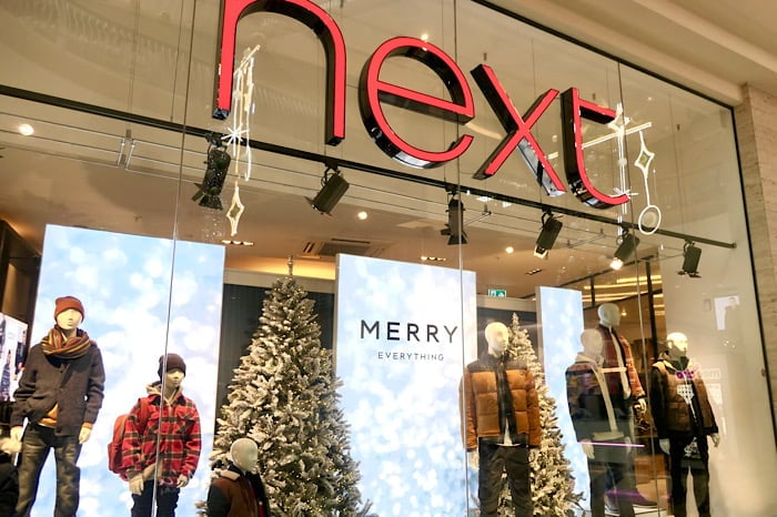 Next maintains annual profit guidance after dip in full price sales
