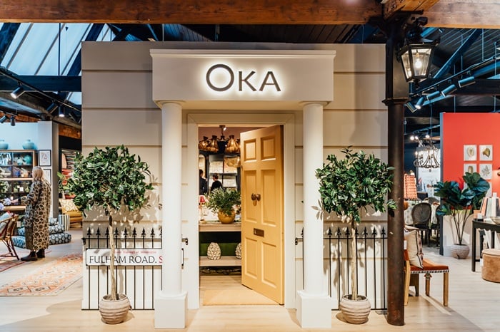 OKA reports improved trading as losses narrow